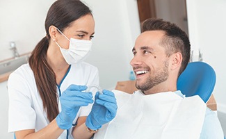 Patient and dentist discuss the cost of Invisalign in Reno