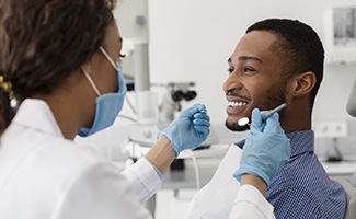 Man at dental checkup with his Reno dentist