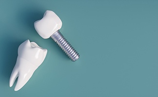 Dental implant in Reno next to model of a natural tooth