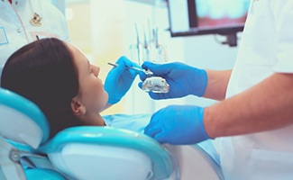 Dentist treats patient