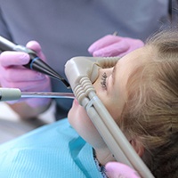 Dental team conducting treatment with nitrous oxide