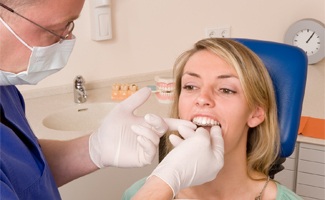 A woman being fitted for Invisalign
