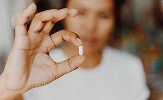 a patient holding oral conscious sedation medicine in Reno