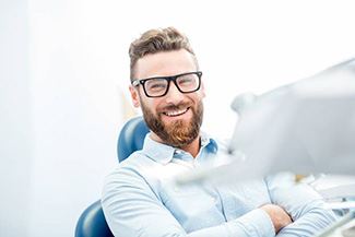 Man smiling in dental chair