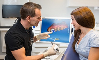 Dentist and Patient looking at CEREC crown design