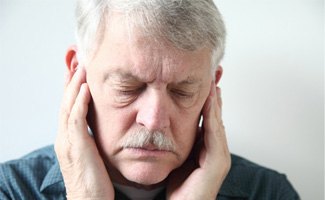 Concerned older man with TMJ disorder in Reno, NV