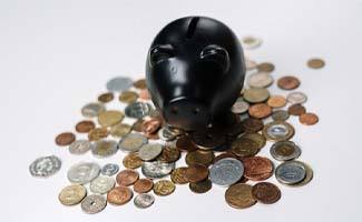 Black piggy bank with coins