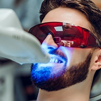 a man receiving teeth whitening treatment