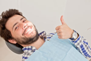 man smiling in dentist chair