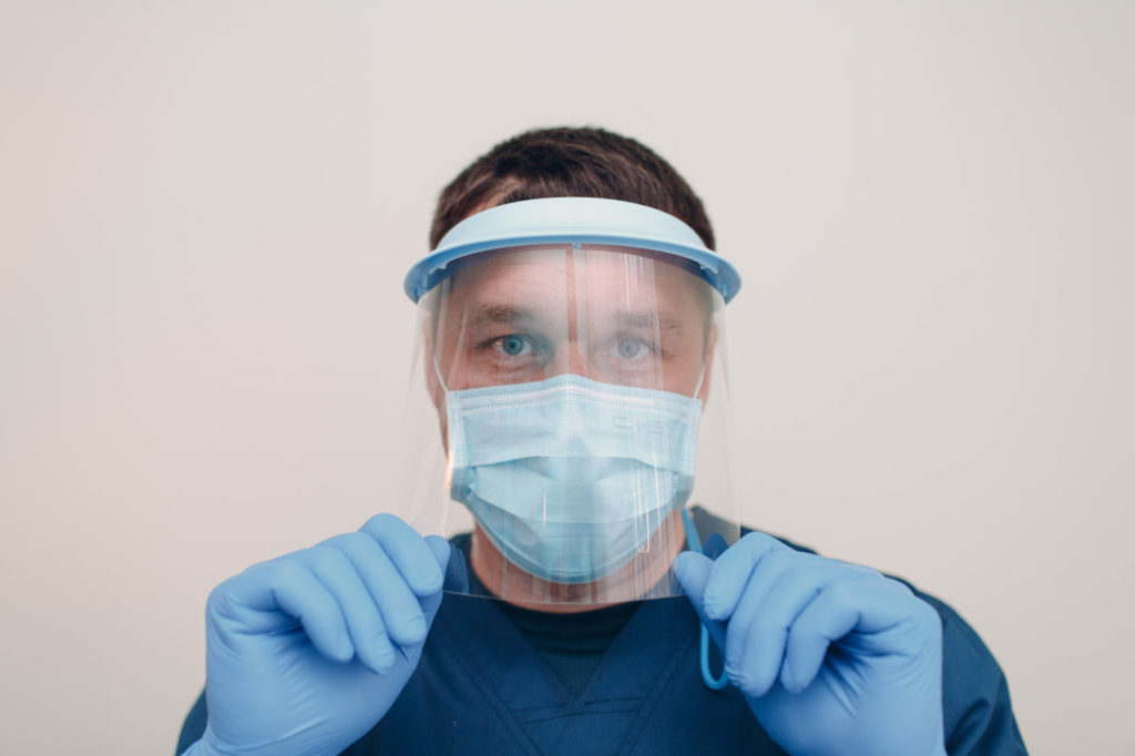 A dentist in Reno uses protective equipment.