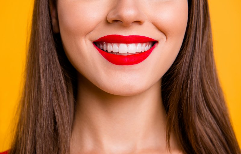 Woman smiling after gum recontouring procedure