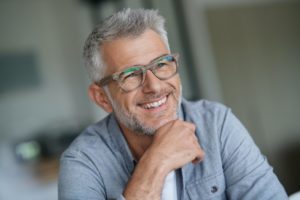 gray-haired man smiling after seeing his cosmetic dentist in Reno 