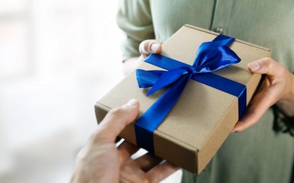 person giving teeth whitening as a gift