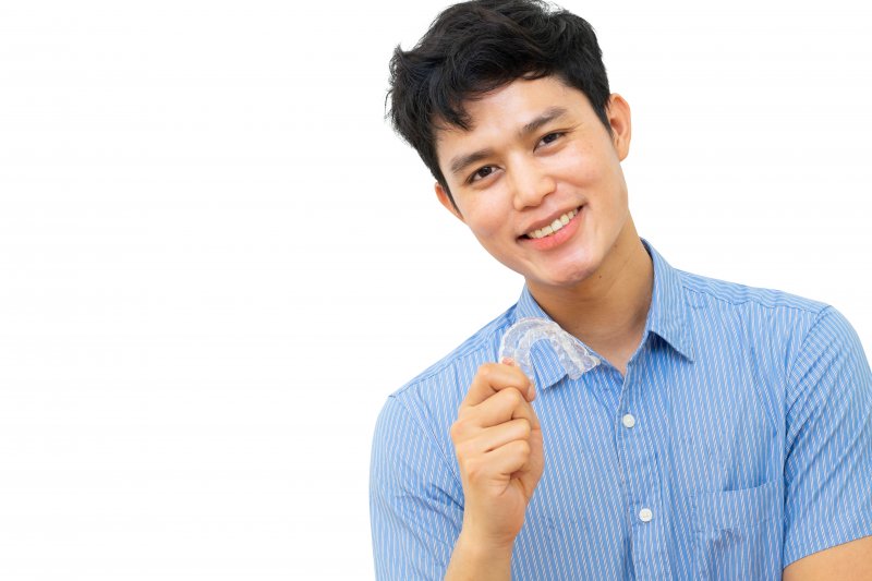 man smiling about the Invisalign wear time in Reno