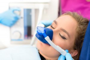 a woman receiving dental sedation during a dental visit