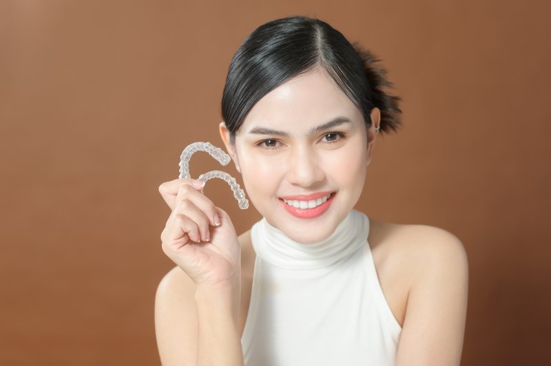 Lady shows off Invisalign clear aligners